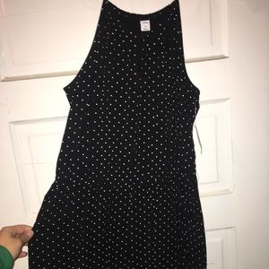 Black with white polka dot romper. Size M